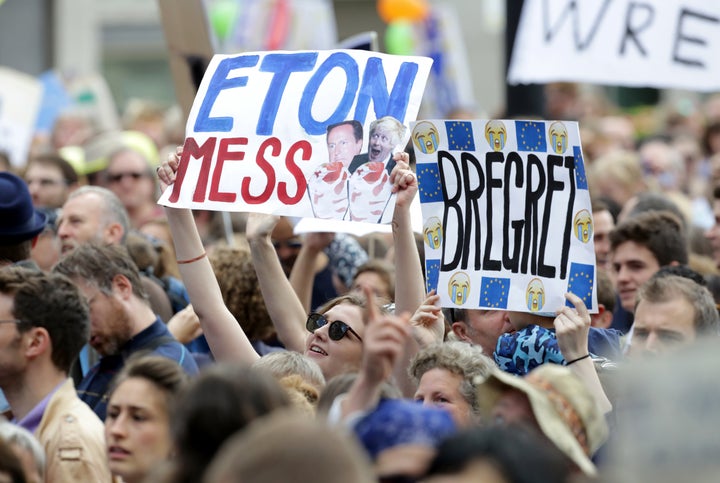 People hold banners during a demonstration against Britain's decision to leave the European Union, in central London, Britain