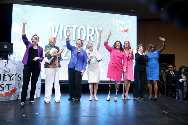 Elizabeth Warren, Ellen Malcolm, Debbie Stabenow, Deborah Roos, Tammy Duckworth, Katie McGinty, Jeanne Shaheen and Val Demings attend an EMILY's List event at the Democratic National Convention on July 27.