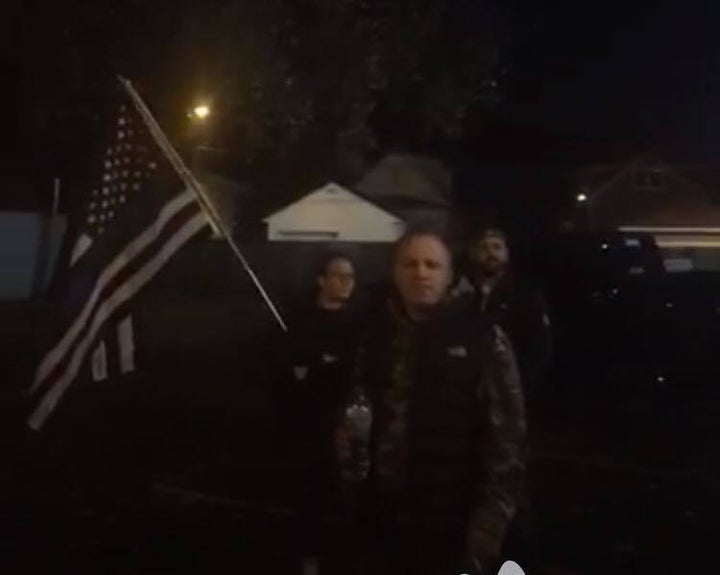 Mount Greenwood residents waving the flag while friends and family of Joshua Beal grieve his death. Photo via Black Lives Matter Chicago.