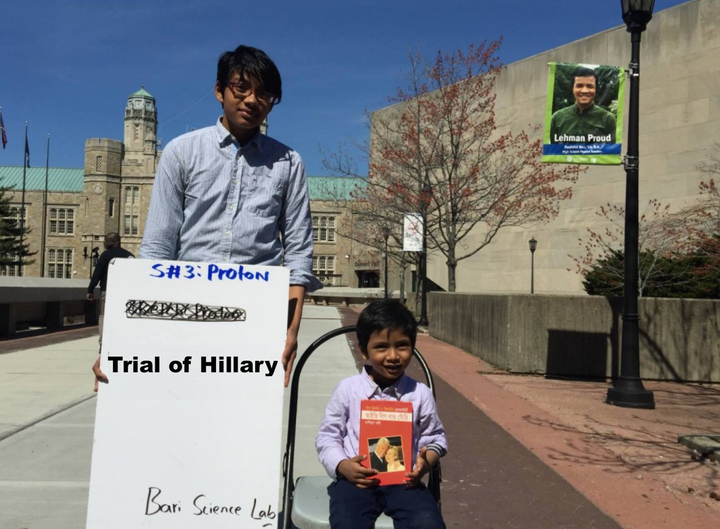 Albert and Isaac, the author’s two sons, are holding book, "Ivy League Love Story (আইভিলিগ লাভ স্টোরি)" on Lehman College’s c