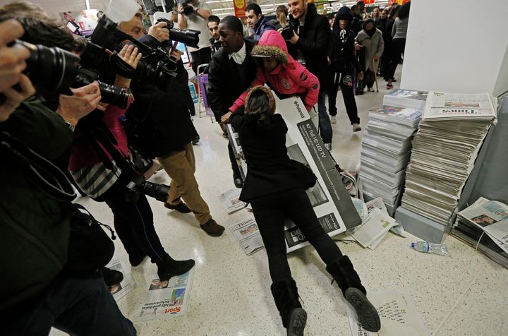 <strong>Frenzied scenes as shoppers fight over deals on Black Friday 2014</strong>