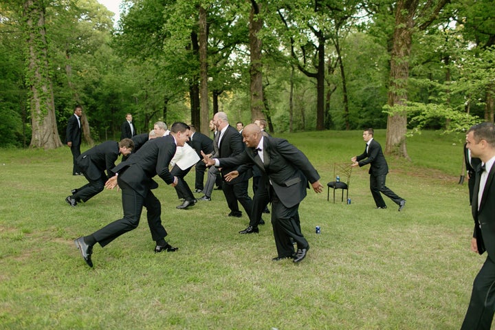 The groomsmen played a little game of touch football in their tuxes. 