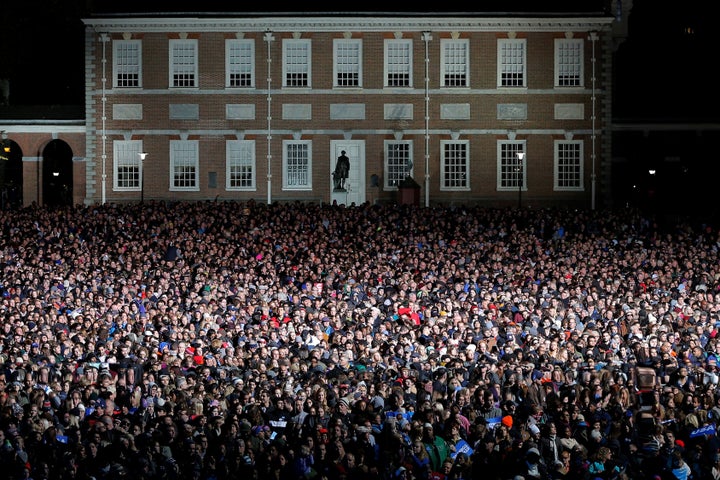 People gather on Independence Mall for the campaign rally the final day before the election.