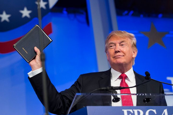 Donald Trump, president and chief executive of Trump Organization Inc. and 2016 Republican presidential candidate, holds up a Bible while speaking at the Values Voter Summit in Washington, D.C., U.S., on Friday, Sept. 25, 2015.