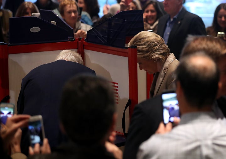 <strong>Hillary Clinton and her husband, former president Bill Clinton, vote at their polling station in Chappaqua, New York</strong>