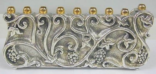 <p>Grape vine motif on a modern Menorah</p>