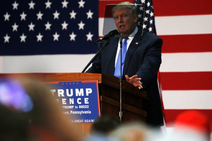 Republican presidential nominee Donald Trump reads from a teleprompter as he addresses a campaign rally in Newtown, Pa., on&n