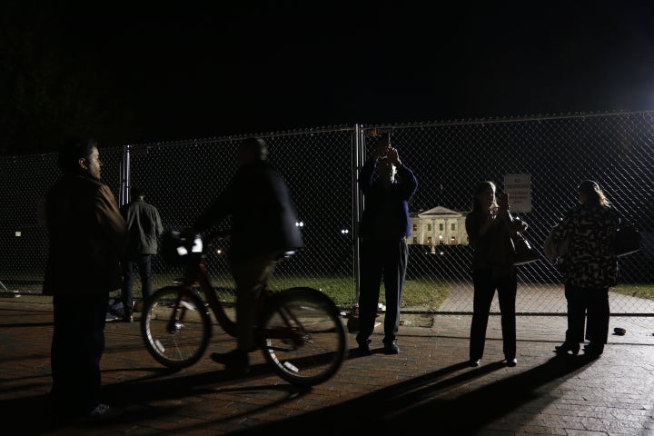 People take photos outside the White House in Washington during the US presidential election night on November 8, 2016.