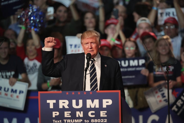 Republican presidential nominee Donald Trump addresses supporters during a campaign rally on November 8, 2016 in Grand Rapids