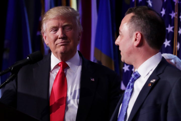 Republican president-elect Donald Trump and Reince Priebus, chairman of the Republican National Committee, look on during his election night event at the New York Hilton Midtown in the early morning hours of November 9, 2016 in New York City.