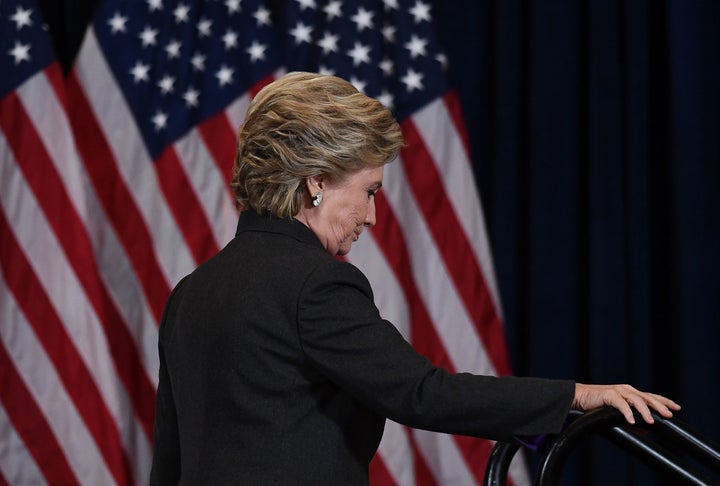 Hillary Clinton steps down a staircase after making a concession speech following her defeat to Republican President-elect Donald Trump, in New York on November 9, 2016.