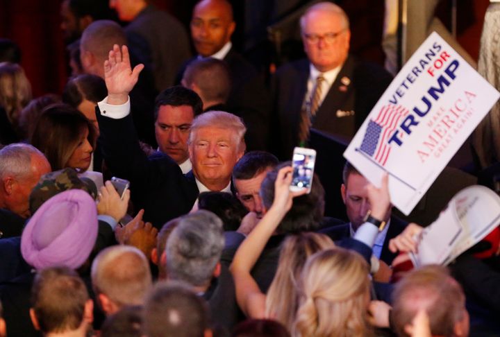 Donald Trump gestures to the crowd after addressing his supporters and celebrating his presidential win on Nov. 9, 2016.