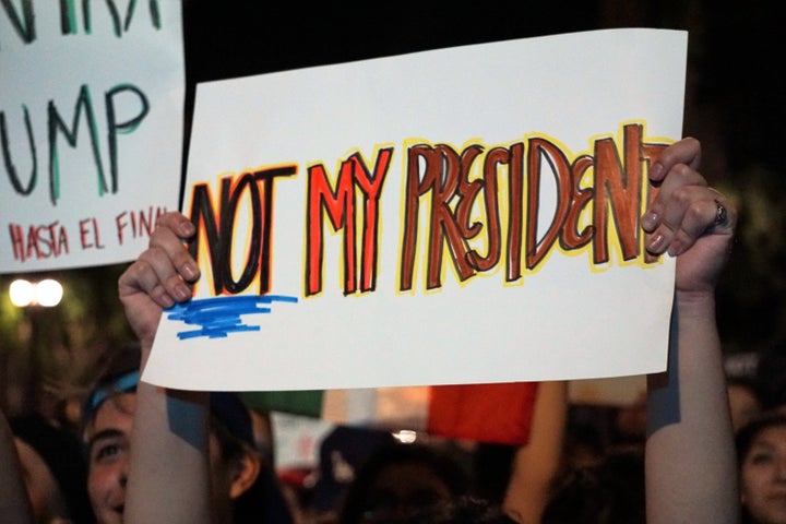 Protesters gather in front of the Los Angeles Municipality building during a protest against President-elect Donald Trump in