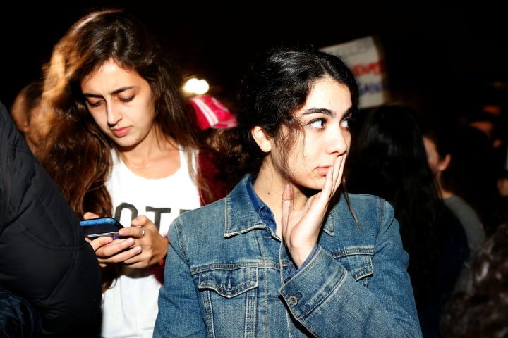 Hillary Clinton supporters react outside the White House in Washington during the US presidential election night on November 9, 2016.