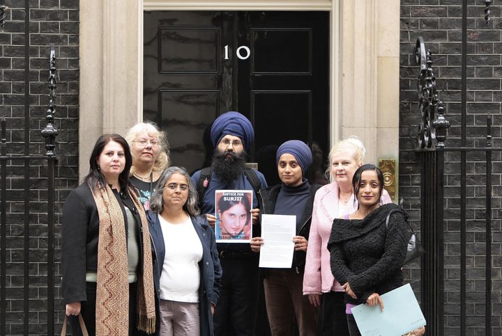 Family and friends of Surjit Kaur Athwal, who was the victim of an honour killing organised by her husband and 70 year old mother-in-law, (from the left) Diana Nammi, Iranian & Kurdish Womens Rights Org.; Kathryn Zoechild, Treasurer of Justice for Surjit Campaign; Hannanah Siddiqui, Southall Black Sisters; Jagdeesh Singh, brother of Surjit; Paramjeet Kaur, wife of Jagdeesh Singh; Susanne Lamido, Islington Community Activist and Charanjit Kaur, sister of Paramjeet Kaur, hand in a petition to 10 Downing Street requesting a public inquiry be carried out to investigate the handling of the case.