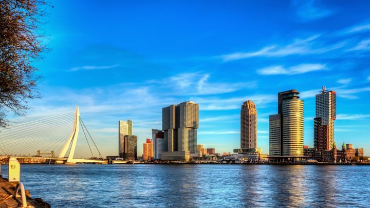 Rotterdam's modern skyline with world famous Erasmus Bridge at left and the massive De Rotterdam building, left of center. 