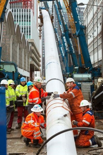 Installing underground piping for Rotterdam's district heating system. 