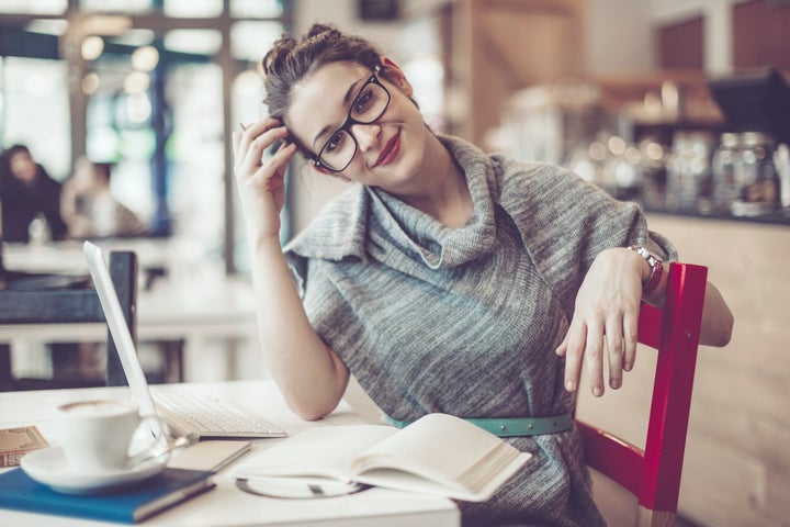 Pretty woman is working in a cafÃ© Eva-Katalin via Getty Images