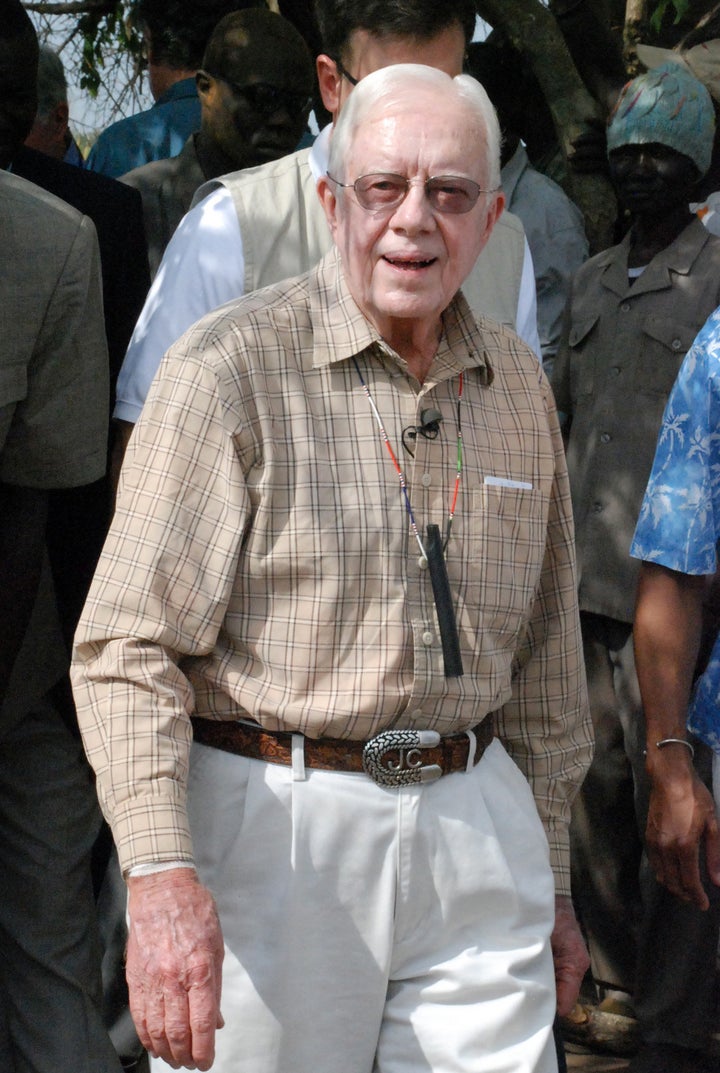 Former U.S. president Jimmy Carter visits the Sudanese village of Lojura -- one of the world's worst areas for Guinea worm -- on Feb. 11, 2010. The Carter Centre has been working in Sudan since 1989 to eradicate it.