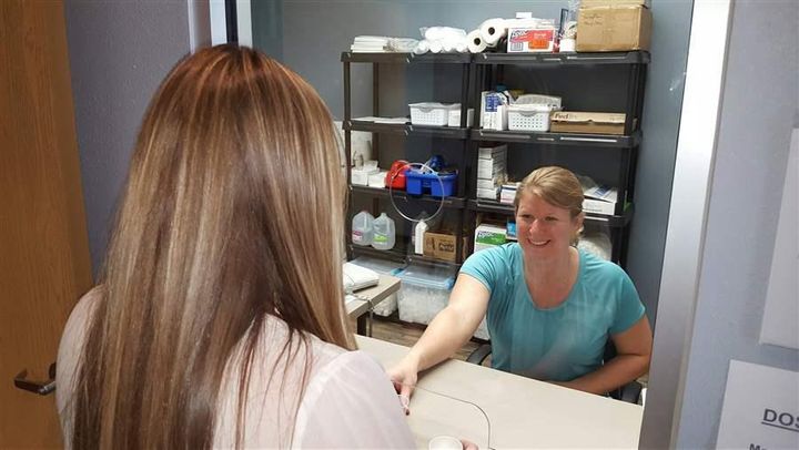 Faye Jorde, lead nurse at Community Medical Services in Minot, North Dakota, gives Rebecca Schmaltz a dose of methadone. Few new methadone clinics have opened in the last five years.