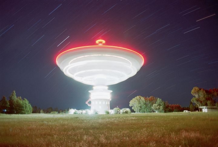 The radio telescope at Parkes, Australia, revolves at night during routine maintenance.