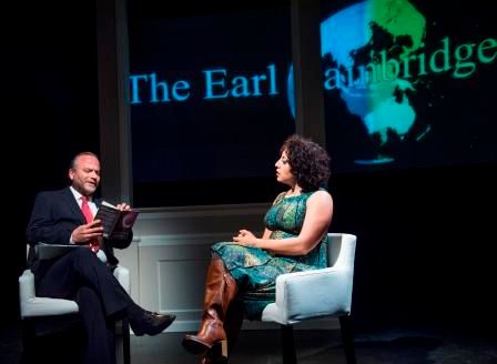 TV host Earl Bainbridge (Dale Albright) interviews Arab-American novelist Noor Badrawi (Denmo Ibrahim) in a scene from Our Enemies: Lively Scenes of Love and Combat 