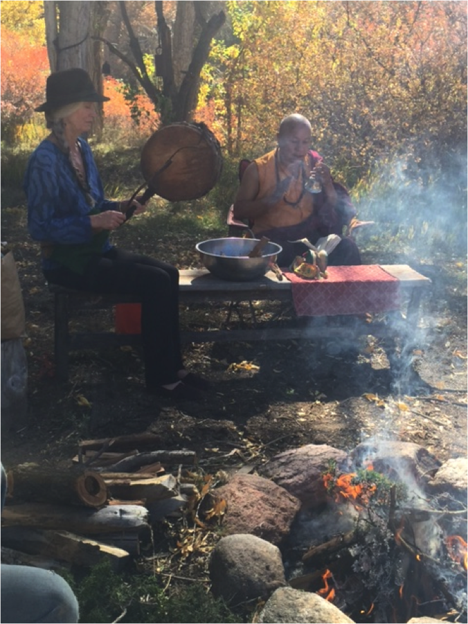 <p><strong>Cynthia Jurs and Lama Tsultrim perform the Riwo Sang Chod fire ceremony for purification of the land. </strong></p>