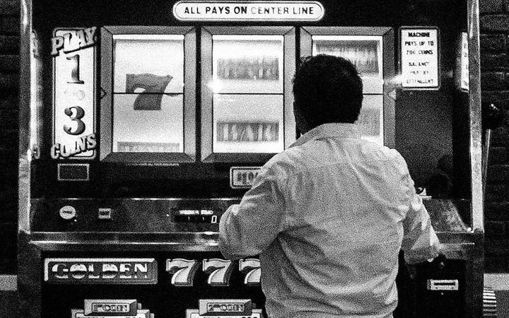 Playing a slot machine in Las Vegas.