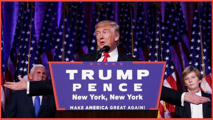 President-elect Donald Trump delivering acceptance speech in New York City (Nov 9, 2016) with Vice-President Elect (left hand side) and Trump’s youngest son Barron Trump (right hand side) listening behind him. 