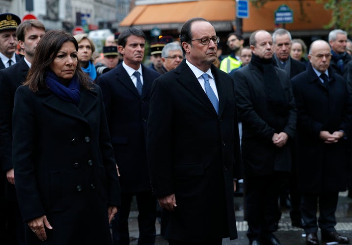 French President Francois Hollande and Paris Mayor Anne Hidalgo unveil a commemorative plaque next to the A La Bonne Biere cafe in Paris.