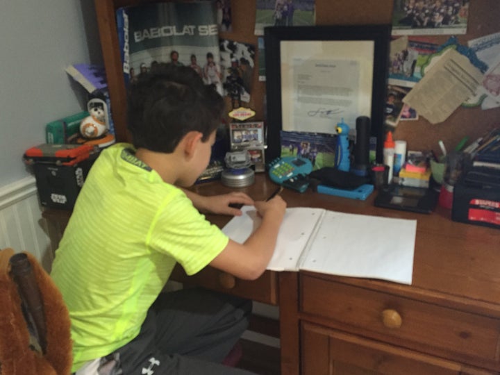 <p>My son writing down his questions for me to take to the Food Allergy Bloggers Conference (FABlogcon) in Denver, Colorado.</p>
