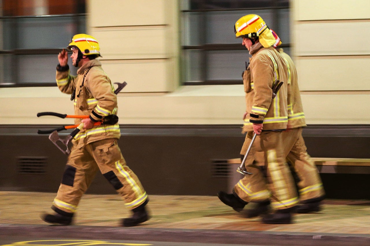 Firemen attend a callout after an earthquake.