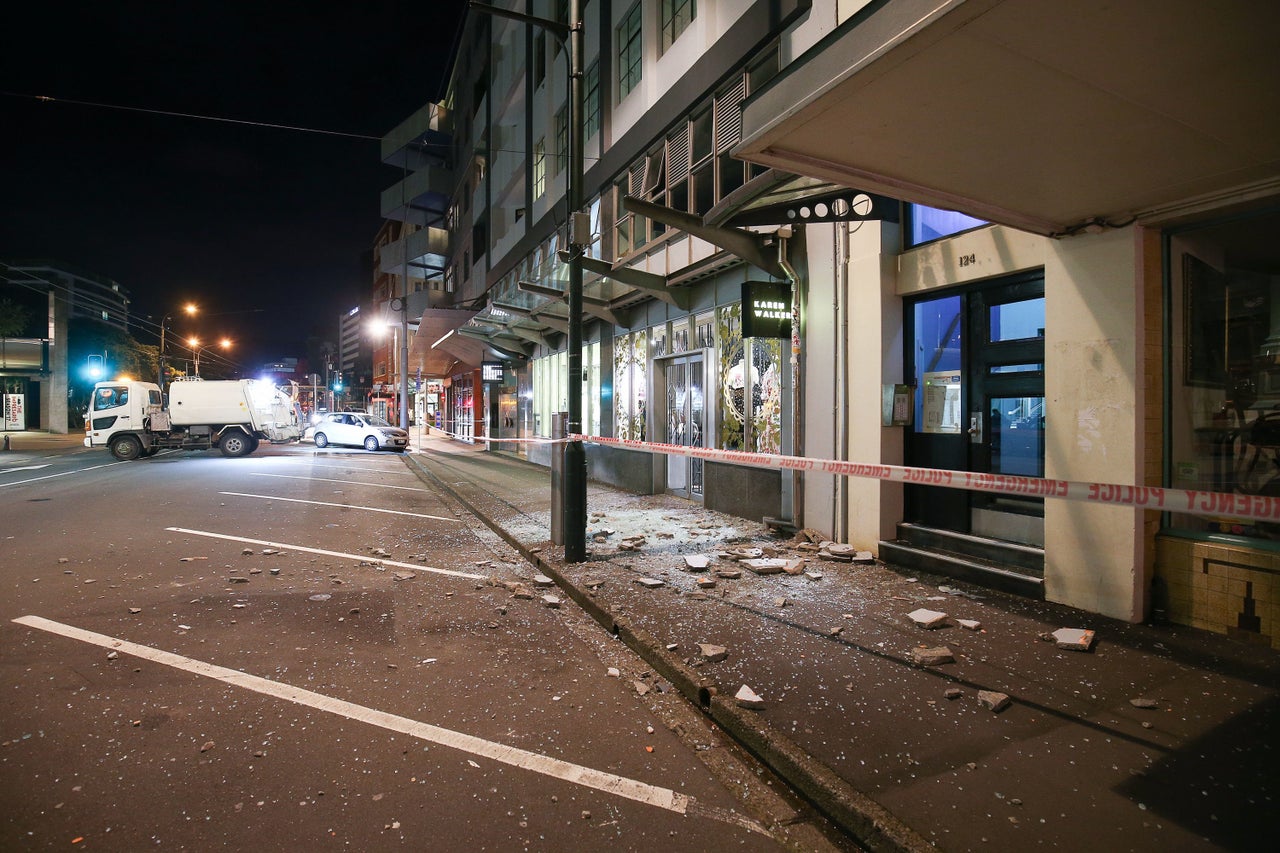 Glass and rubble covers the footpath in Wellington, New Zealand.