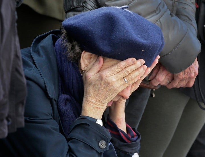 A woman pays tribute to victims at Place de la Republique after the deadly attacks in Paris, Nov. 16, 2015.