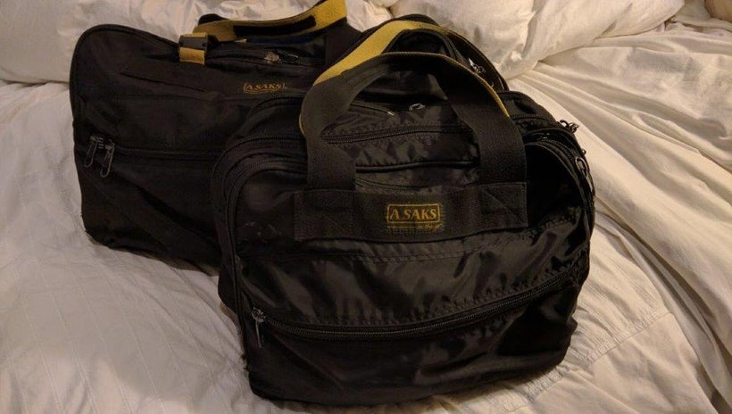 <em>Unstructured canvas luggage is adaptable with multiple zippers and is well worn to blend in</em>