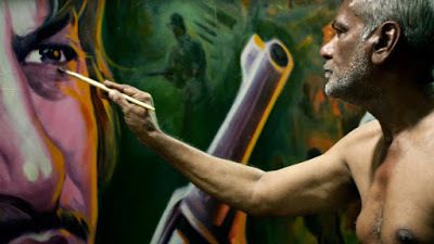 <p>Sheik Rehman painting a billboard for a movie in a scene from <strong><em>Original Copy</em></strong> </p>