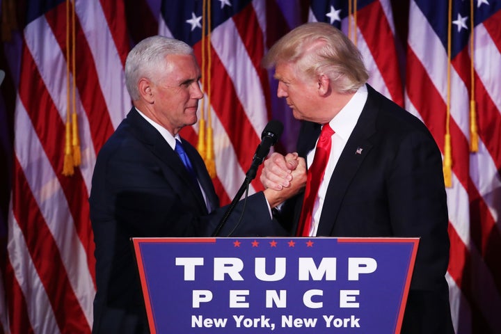 Vice president-elect Mike Pence and Republican president-elect Donald Trump shake hands during his election night event in New York City.