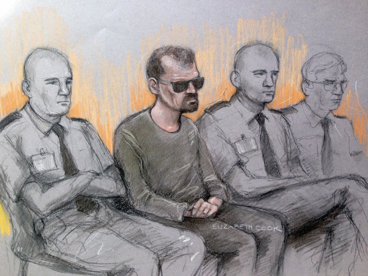 Court artist sketch of Stefano Brizzi, second left, in the dock at the Old Bailey, London.