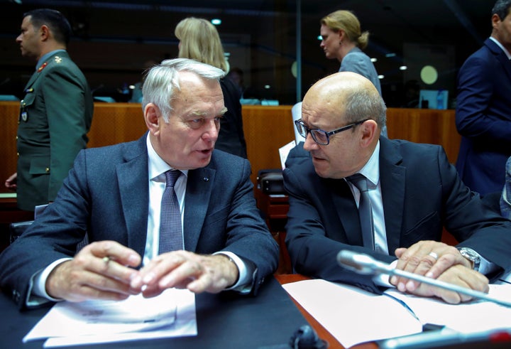 France Foreign Minister Jean-Marc Ayrault (L) and France's Defence Minister Jean-Yves Le Drian attend a European Union foreign and defence ministers meeting in Brussel.