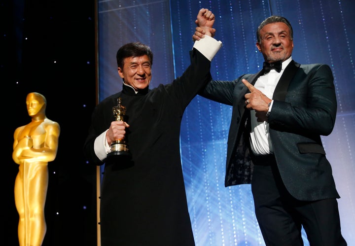 Sylvester Stallone congratulates Jackie Chan.