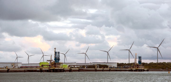 <p><strong><em>Wind turbines behind gates of LNG Terminal at Maastvlatke, Port of Rotterdam.</em></strong></p>