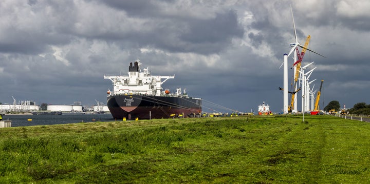 Wind turbines and Kuwaiti oil tanker Al-Yarmouk at the Port of Rotterdam's Calandkanaal.