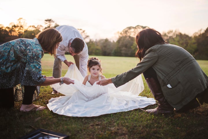 “It may have been emotional for us adults, but because Nora was so excited, we tried to make it happy for her,” the photographer said of the photo shoot.