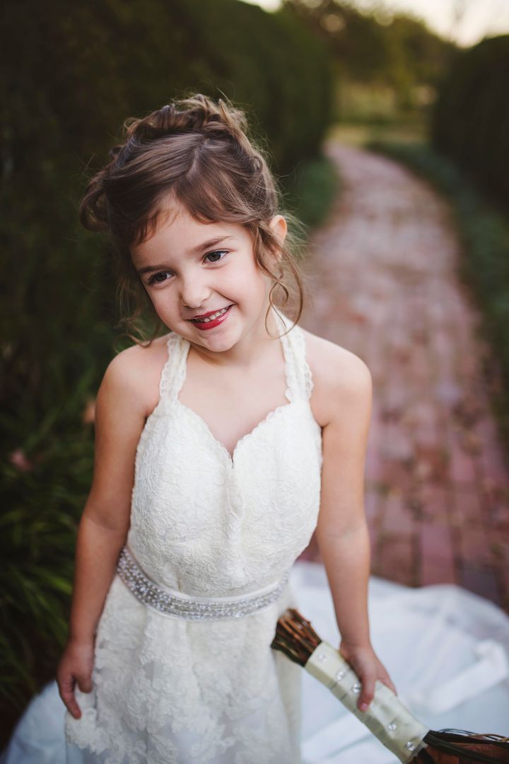 Little Girl Poses In Late Mother's Wedding Dress In Beautiful Photo ...