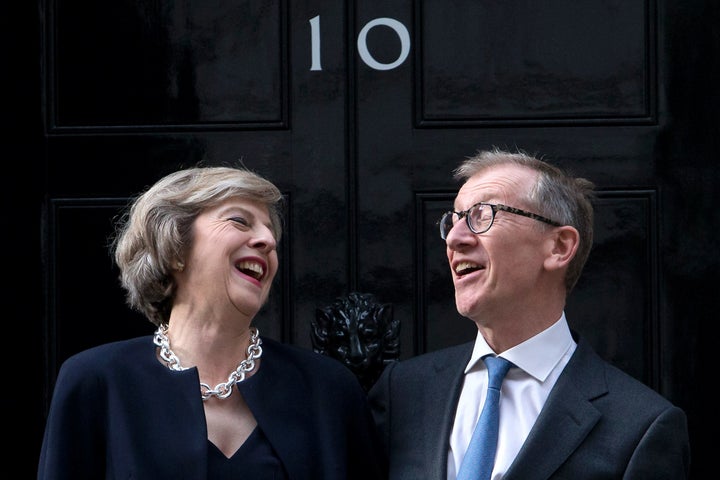 <strong>Theresa May and her husband Philip John May outside 10 Downing Street.</strong>