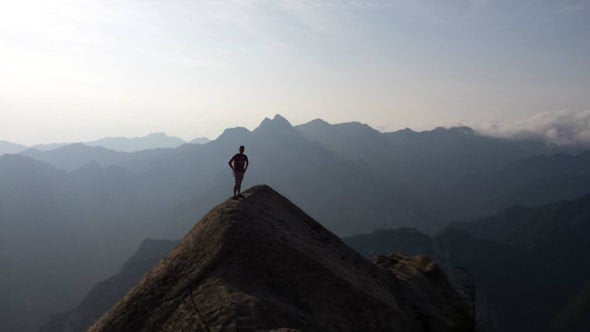 <strong>The 21-year-old on a mountain in China in 2015 </strong>