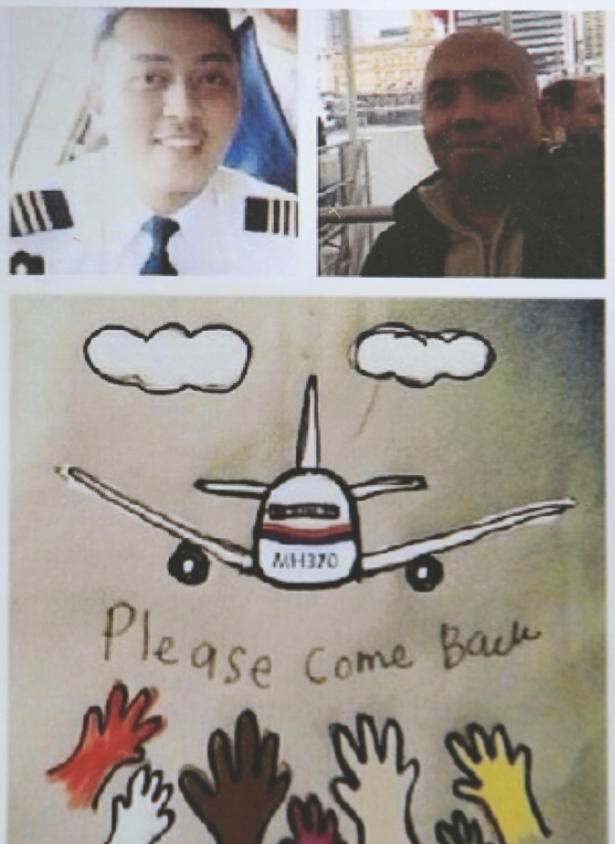 <strong>A photo of Zaharie Shah (top right) and co-pilot Fariq Abdul Hamid (top left) atop a poster appealing for the missing plane to ‘please come back’</strong>