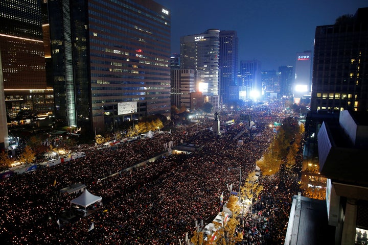 People take part in a rally calling for President Park Geun-hye to step down in central Seoul, South Korea, November 12, 2016.