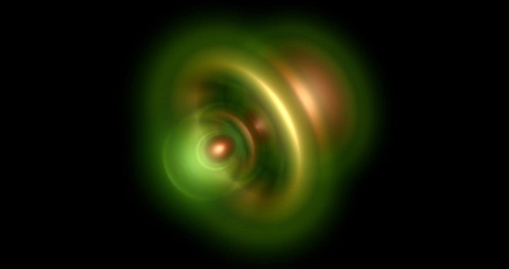 This image shows a photon removing an electron from a helium atom, with the remaining electron most likely near the bright nucleus. 