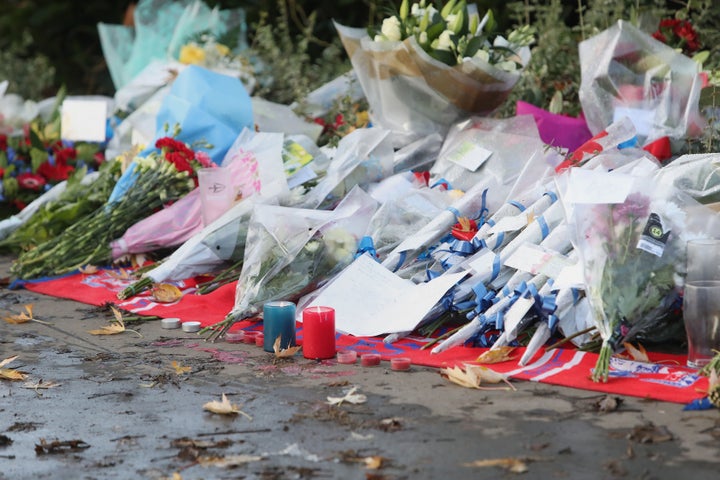 Floral tributes are being left at the scene 